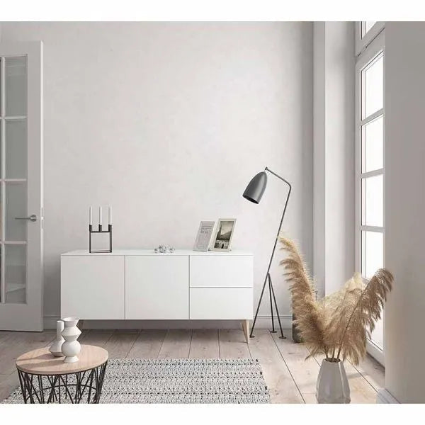 Wallpaper installed in a room showing its full pattern, color