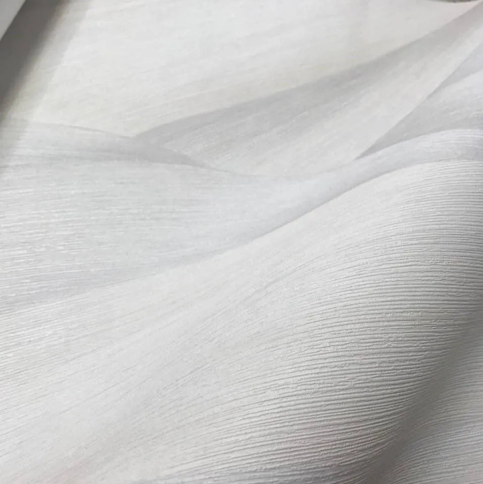 Wallpaper installed in a room showing its full pattern, color