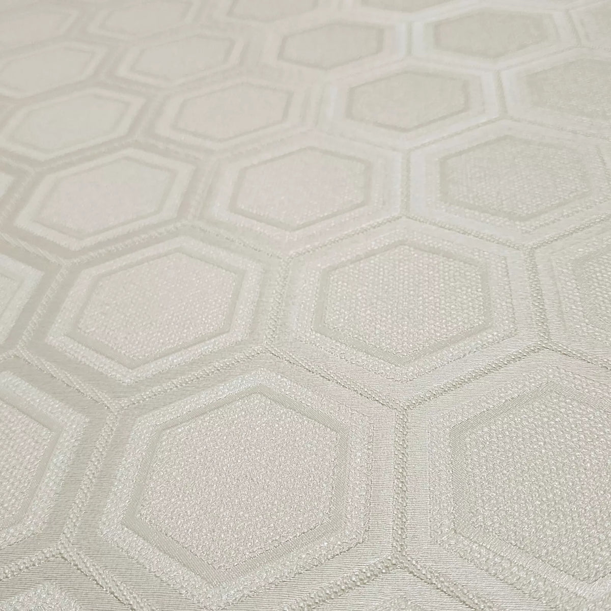 Textured wallpaper with a geometric hexagonal pattern in light gray.