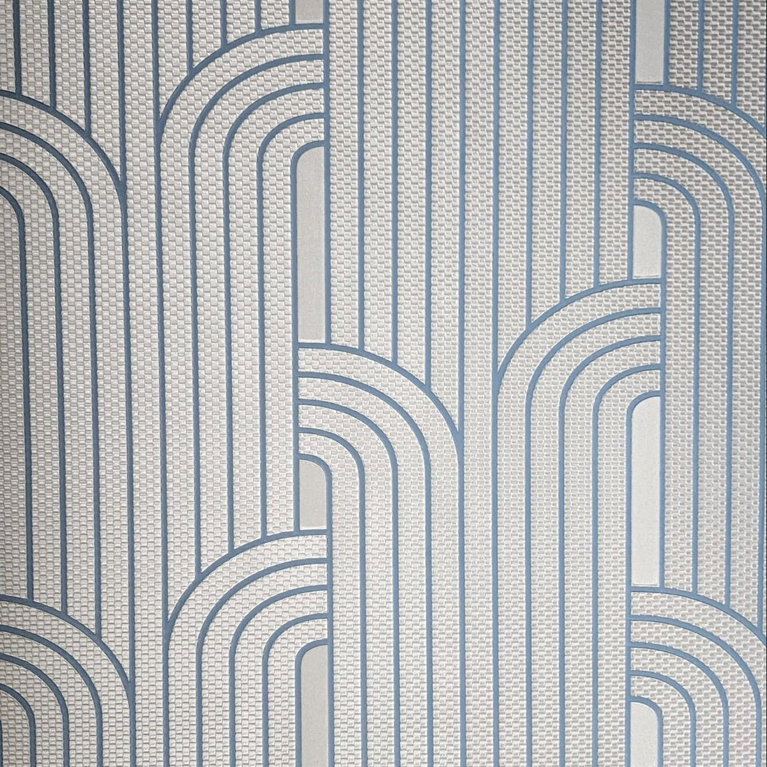 Patterned wallpaper with geometric design in blue and gray