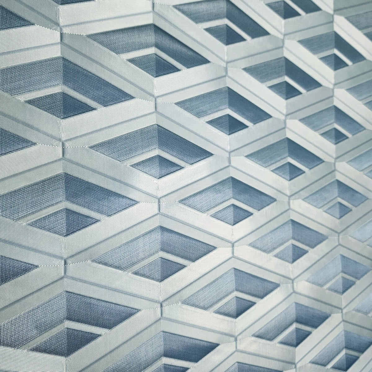 Geometric patterned wallpaper with blue and gray tones