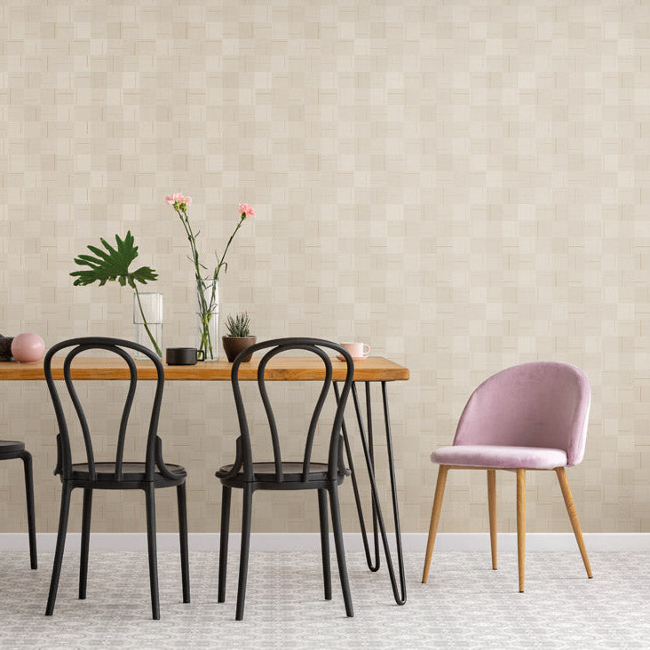 Dining table with chairs against a beige wall