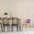 Dining table with chairs against a beige wall