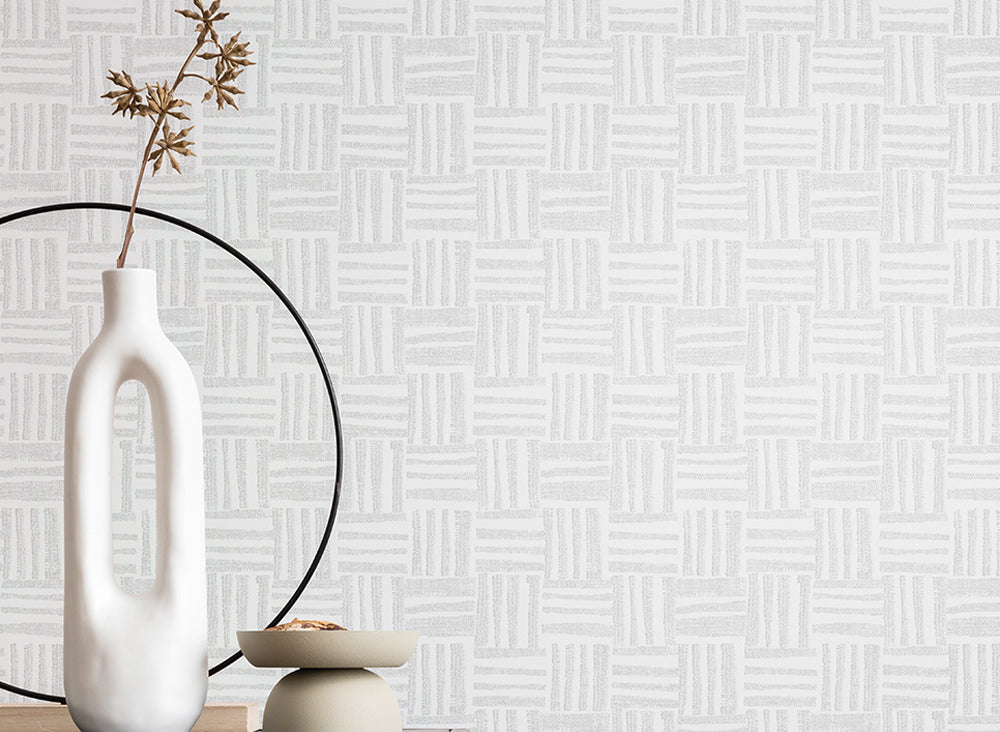 Textured patterned fabric with geometric design in blue and beige tones.