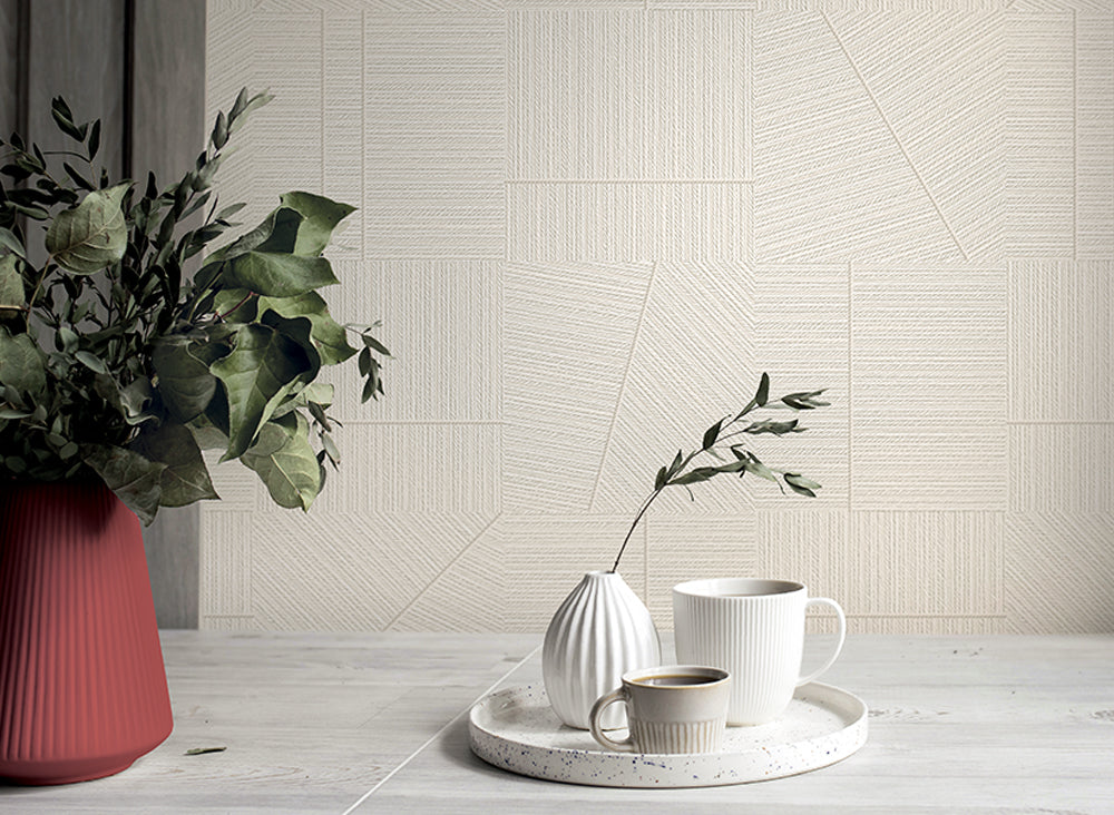 Geometric patterned wallpaper with a herringbone design in neutral tones.