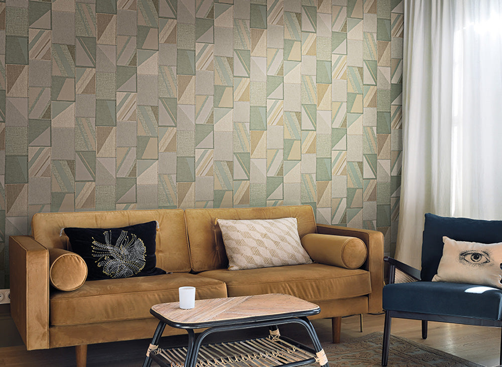 Living room with a brown sofa, patterned wall, and decorative pillows.
