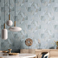 Geometric patterned wall tiles with decorative items in a room setting.