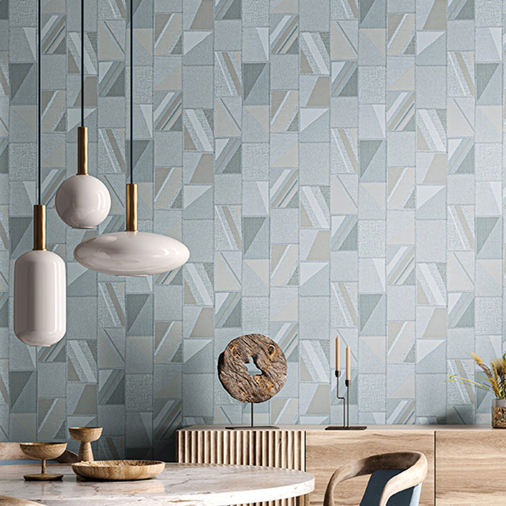 Geometric patterned wall tiles with decorative items in a room setting.