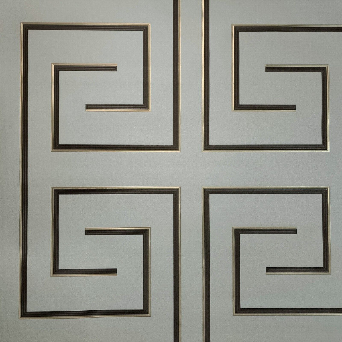Decorative wallpaper with geometric patterns on a light gray background