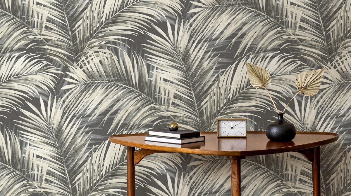 Erismann Cameo 10531-15 wallpaper creating a sophisticated charcoal palm feature wall behind a console table.