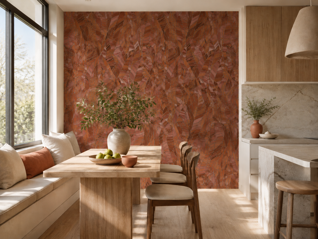 Erismann Elle Decoration 4 terracotta botanical wallpaper with layered leaf pattern and textured finish in a warm cream kitchen with a large wooden dinette