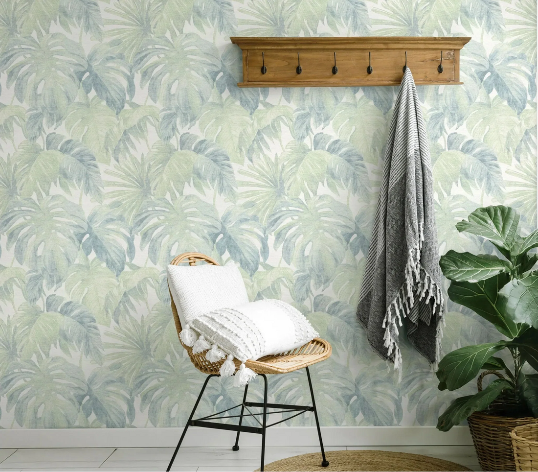 Erismann Forest Dreams 10558-07 green and blue-grey leafy botanical wallpaper with large monstera-style leaves on a linen-look ground