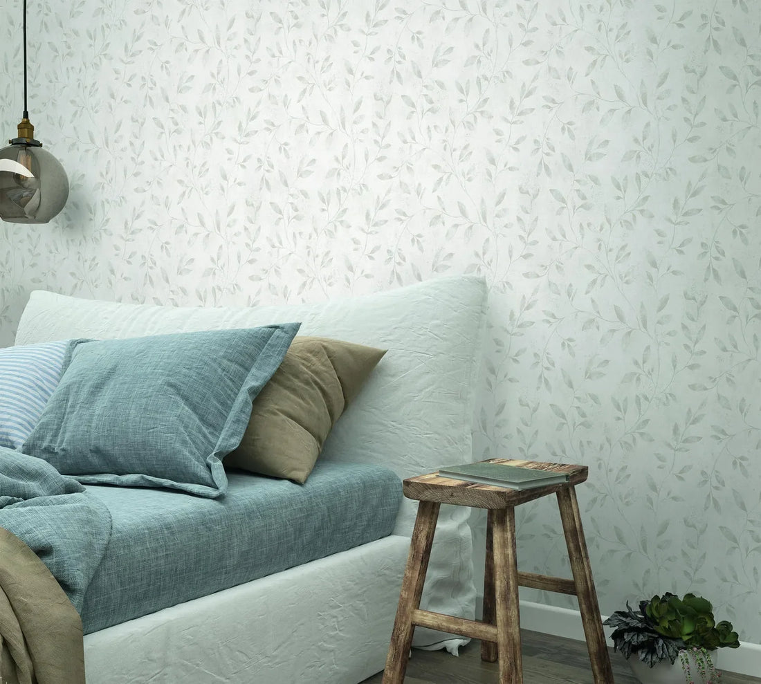 Marburg City Glam 32632 soft white wallpaper with delicate light grey vine leaves on a subtle plaster-like ground.