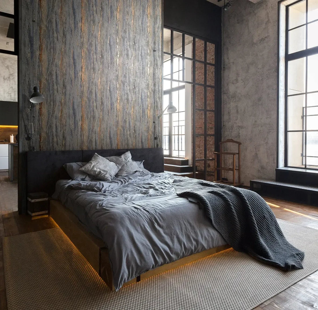 Marburg City Romance 35156 anthracite plaster-look textured wallpaper with warm rust accents and vertical movement.