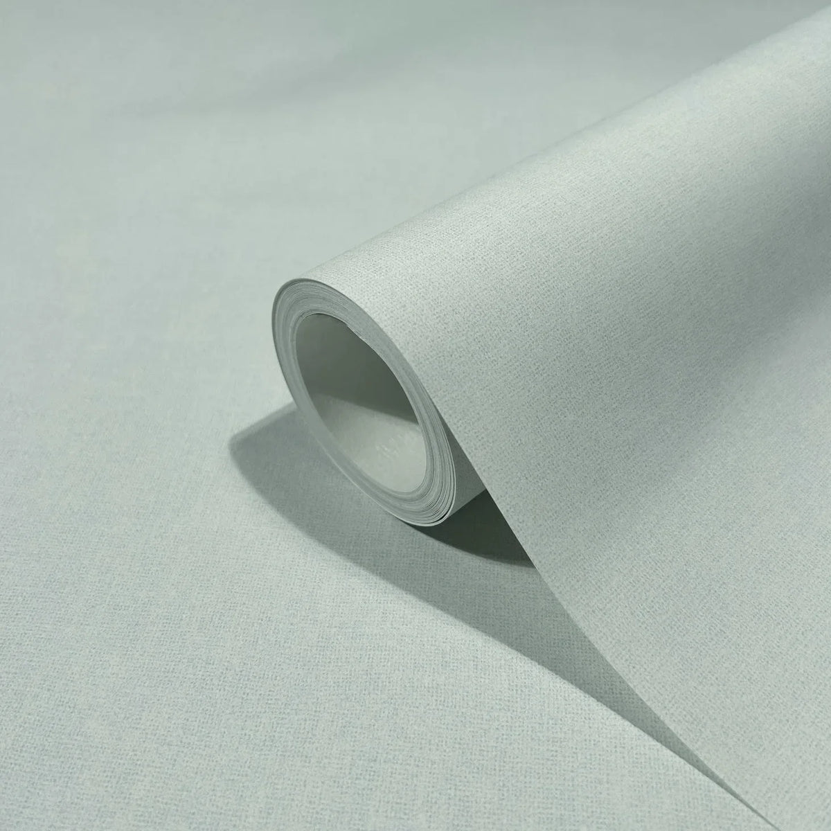 Marburg 47604 wallpaper close-up of a single roll showing fine textured surface on a neutral background.