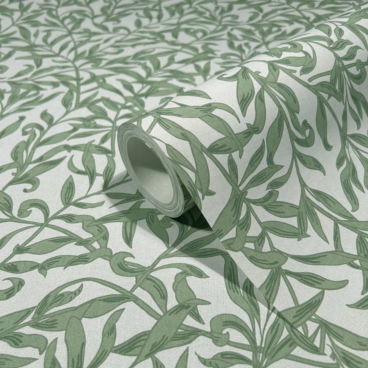 Marburg 47640 wallpaper close-up of green leafy vine pattern on a light background with a partially unrolled roll.