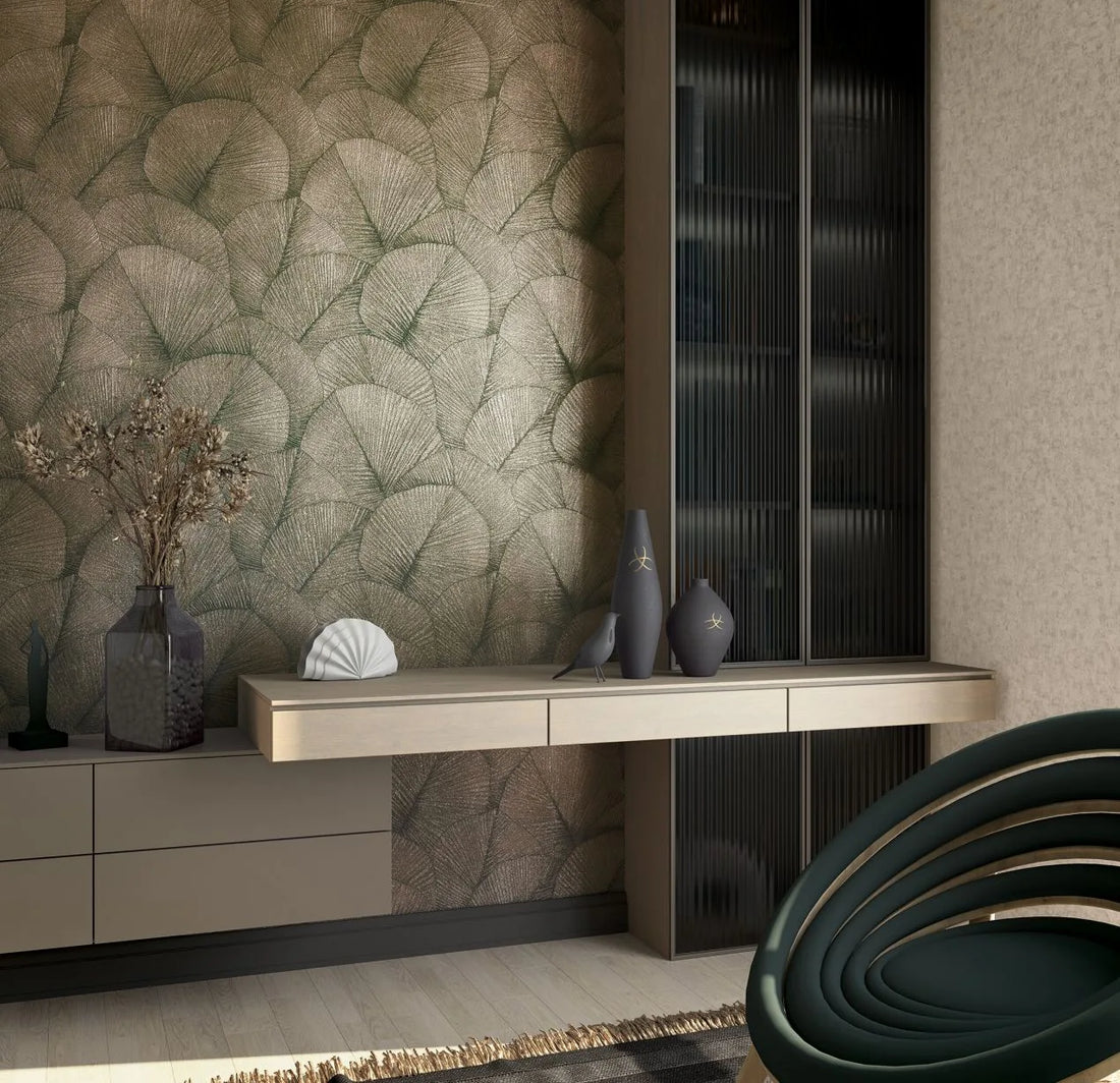 Marburg Kumano 34513 wallpaper with overlapping leafy botanical pattern in muted beige-green tones.