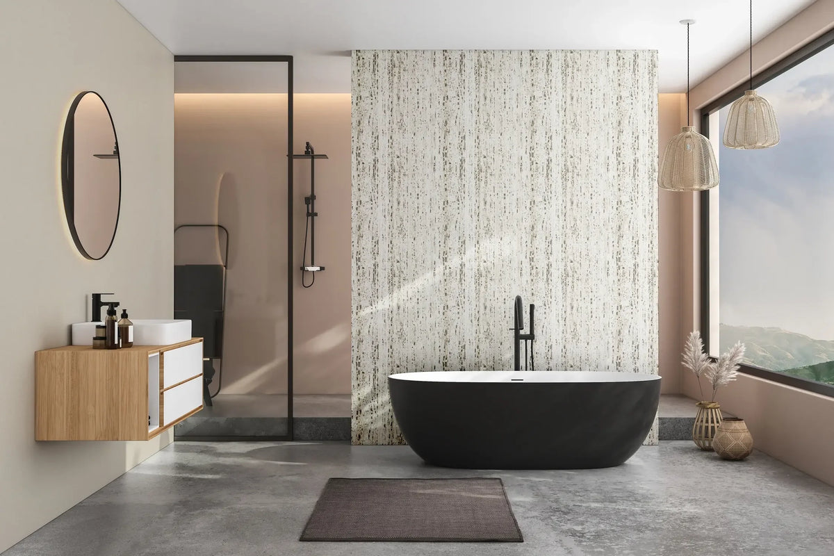Marburg Travertino 33363 Modern bathroom with a feature wall of beige, stone-look wallpaper with vertical striations behind a black freestanding bathtub. A glass shower, floating wood vanity with round mirror, two woven pendant lights, a large window, a floor mat, and decorative woven.