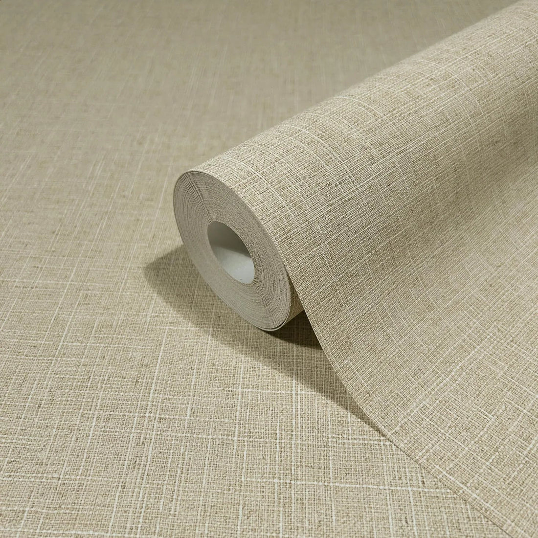 Marburg Travertino 33392 Beige wallpaper with a subtle linen-look crosshatch texture forming an irregular grid wallpaper shown in a styled detail.