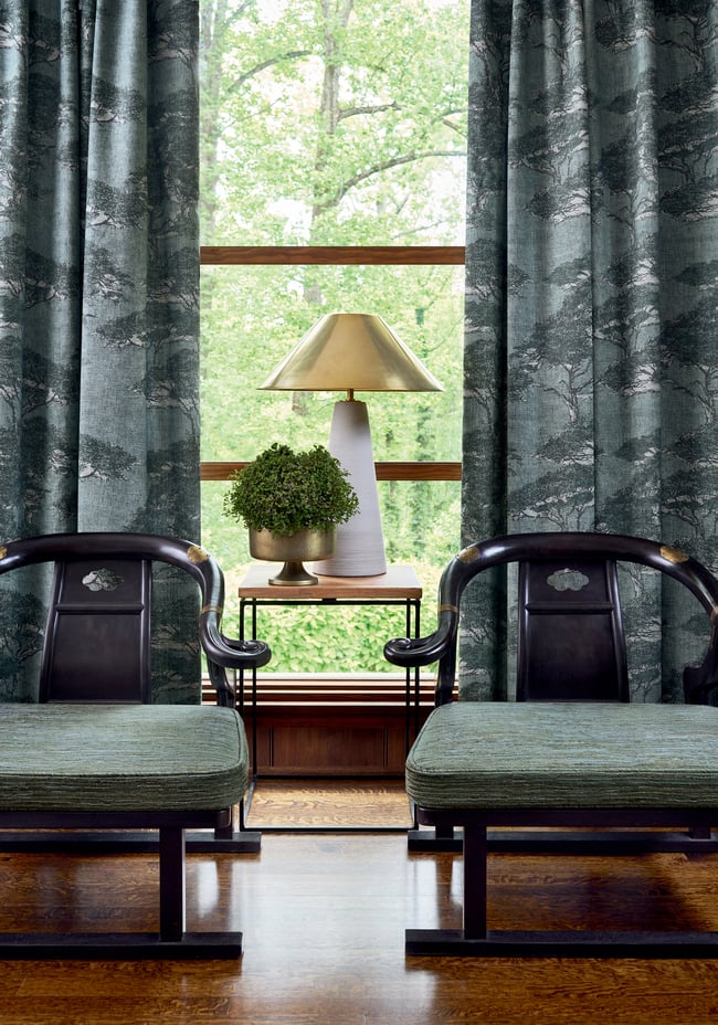 Thibaut Torrey Pines wallpaper in Mineral T24434 with layered pine trees on a dusty blue linen-mesh texture.